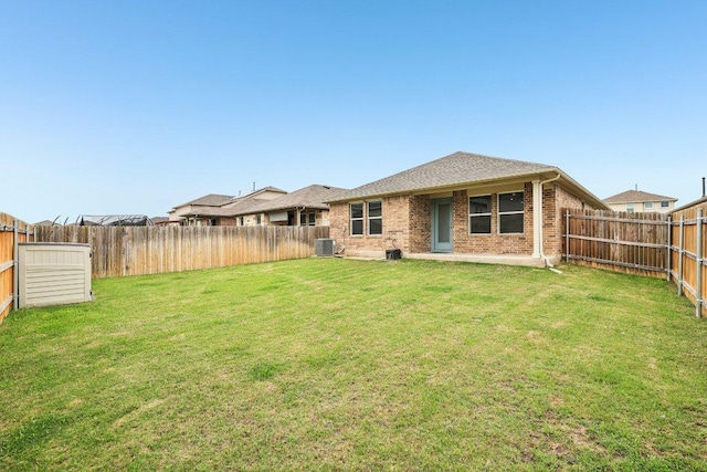 136 Ellinger Rd, Georgetown, TX 78626 - back of property featuring central air condition unit and brick siding