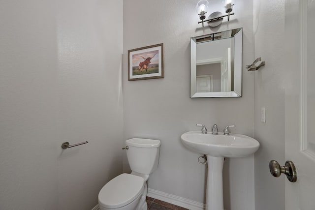 4308 Canyon Glen Cir, Austin, TX 78732 - bathroom with toilet, baseboards, tile patterned floors, and a sink