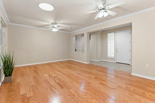 206 Whispering Wind Dr, Georgetown, TX 78633 - empty room with a ceiling fan, light wood-style floors, and crown molding