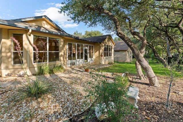 206 Whispering Wind Dr, Georgetown, TX 78633 - rear view of house featuring roof with shingles and stucco siding