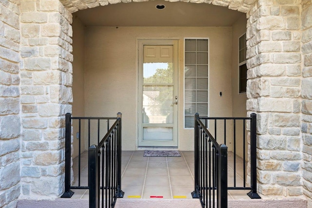 206 Whispering Wind Dr, Georgetown, TX 78633 - doorway to property featuring stone siding