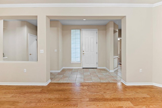 206 Whispering Wind Dr, Georgetown, TX 78633 - foyer entrance featuring baseboards, ornamental molding, and light tile patterned floors