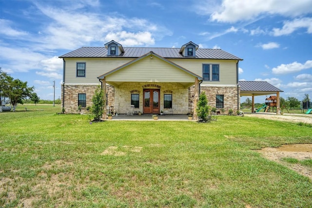 626 Sparta Field Rd, Waelder, TX 78959 - back of property featuring french doors, stone siding, a yard, and a playground