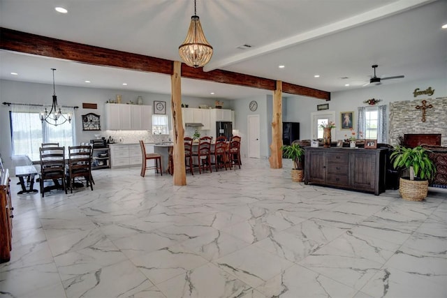 626 Sparta Field Rd, Waelder, TX 78959 - living area featuring a chandelier, beam ceiling, a ceiling fan, recessed lighting, and a stone fireplace