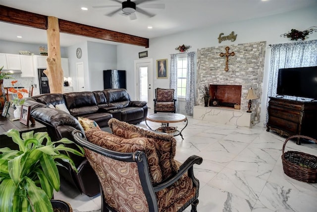 626 Sparta Field Rd, Waelder, TX 78959 - living area featuring a ceiling fan, beamed ceiling, recessed lighting, and a fireplace with raised hearth