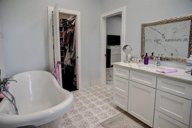 626 Sparta Field Rd, Waelder, TX 78959 - full bathroom featuring a spacious closet, a freestanding tub, and vanity
