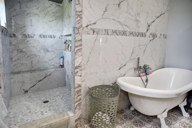 626 Sparta Field Rd, Waelder, TX 78959 - full bathroom with a tile shower, a freestanding tub, and tile walls