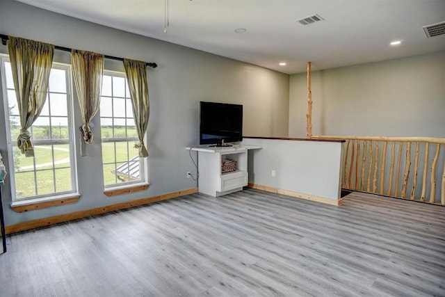626 Sparta Field Rd, Waelder, TX 78959 - unfurnished living room featuring wood finished floors and recessed lighting