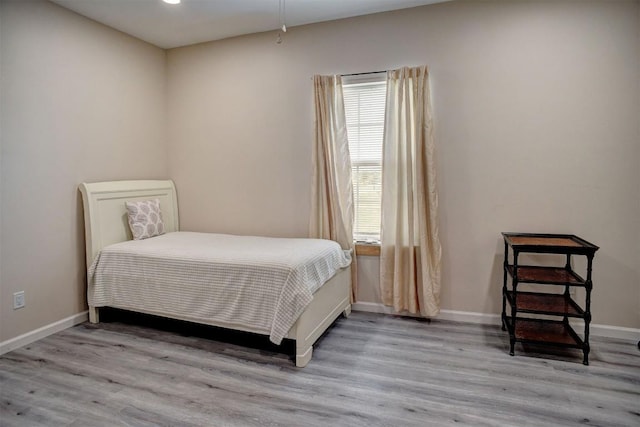 626 Sparta Field Rd, Waelder, TX 78959 - bedroom with wood finished floors and baseboards