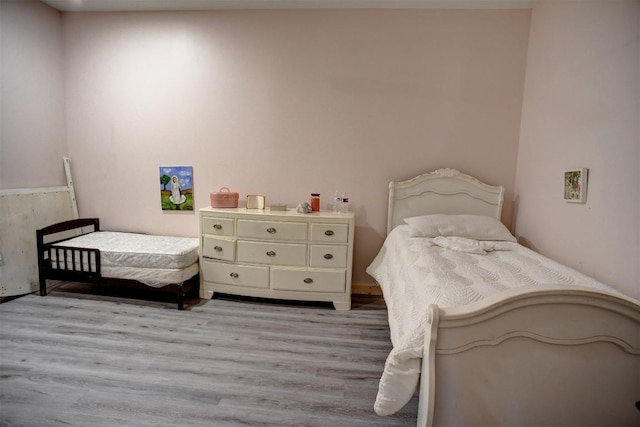 626 Sparta Field Rd, Waelder, TX 78959 - bedroom featuring light wood-style floors