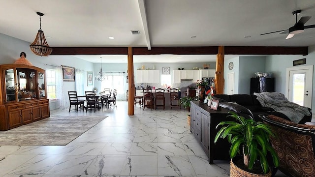 626 Sparta Field Rd, Waelder, TX 78959 - living area with light marble finish floors, a ceiling fan, plenty of natural light, beam ceiling, and recessed lighting
