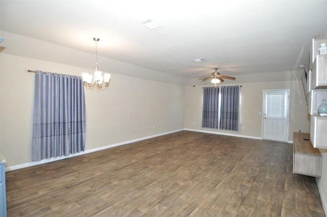 11024 Night Camp Dr, Austin, TX 78754 - spare room featuring a chandelier, dark wood-style flooring, ceiling fan, and baseboards