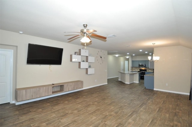11024 Night Camp Dr, Austin, TX 78754 - unfurnished living room featuring dark wood finished floors, a ceiling fan, baseboards, and a chandelier