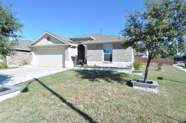 11024 Night Camp Dr, Austin, TX 78754 - view of front of home with an attached garage, brick siding, and concrete driveway