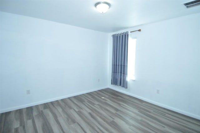 11024 Night Camp Dr, Austin, TX 78754 - spare room with wood finished floors and baseboards