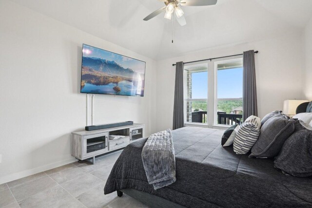 8119 Purple Aster Pass, Leander, TX 78645 - bedroom with lofted ceiling, light tile patterned floors, and ceiling fan
