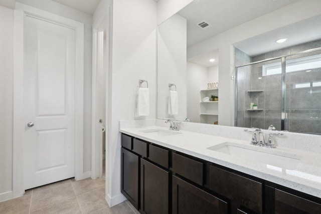8119 Purple Aster Pass, Leander, TX 78645 - full bath with double vanity, a stall shower, and tile patterned floors