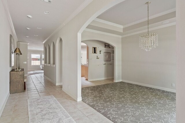 11037 River Plantation Dr, Austin, TX 78747 - hall with tile patterned floors, crown molding, a chandelier, carpet, and arched walkways