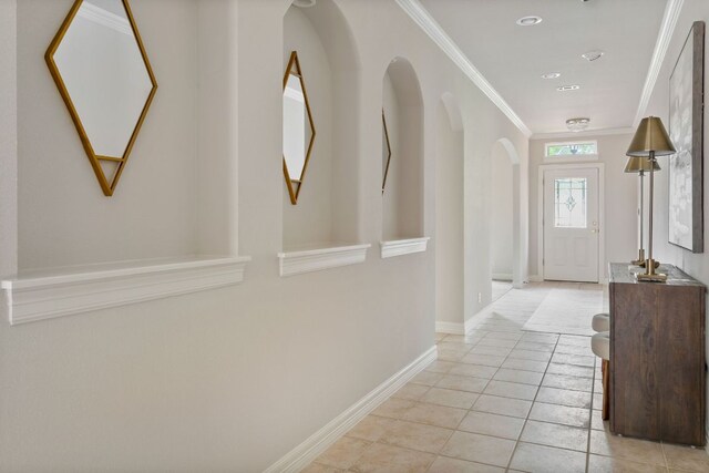 11037 River Plantation Dr, Austin, TX 78747 - hallway featuring crown molding, arched walkways, and light tile patterned flooring