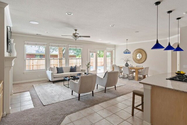 11037 River Plantation Dr, Austin, TX 78747 - living room featuring light tile patterned flooring, light carpet, ornamental molding, ceiling fan, and recessed lighting