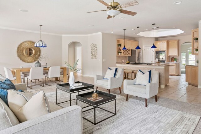 11037 River Plantation Dr, Austin, TX 78747 - living room featuring arched walkways, ceiling fan, recessed lighting, light tile patterned floors, and crown molding