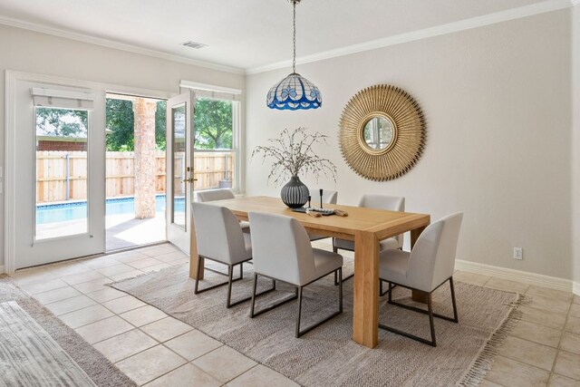 11037 River Plantation Dr, Austin, TX 78747 - dining area with light tile patterned floors and crown molding