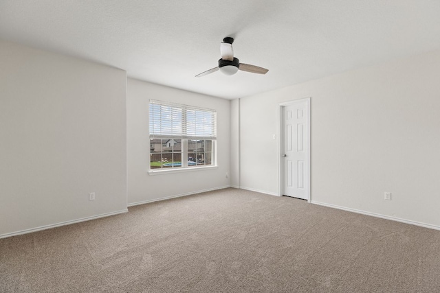 709 Hummingbird Ln, Leander, TX 78641 - spare room featuring a ceiling fan and carpet floors