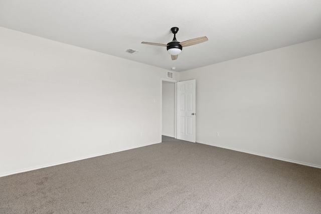 709 Hummingbird Ln, Leander, TX 78641 - spare room with a ceiling fan, dark colored carpet, and baseboards