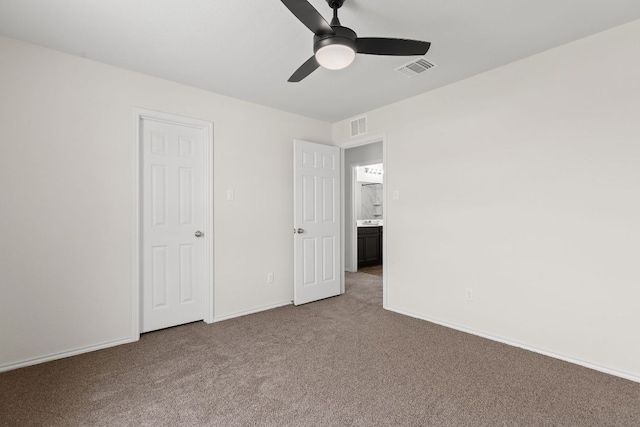 709 Hummingbird Ln, Leander, TX 78641 - unfurnished bedroom featuring light colored carpet, baseboards, and ceiling fan