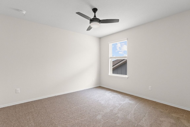 709 Hummingbird Ln, Leander, TX 78641 - spare room with carpet, ceiling fan, a smoke detector, and baseboards