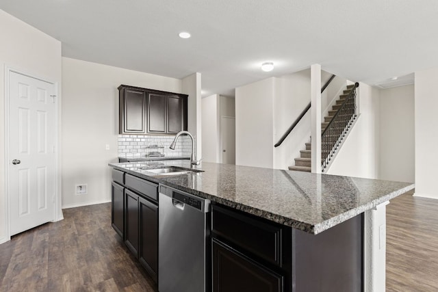 709 Hummingbird Ln, Leander, TX 78641 - kitchen featuring dishwasher, a sink, dark wood-type flooring, tasteful backsplash, and baseboards