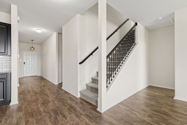 709 Hummingbird Ln, Leander, TX 78641 - foyer entrance with dark wood-style flooring, stairway, and baseboards