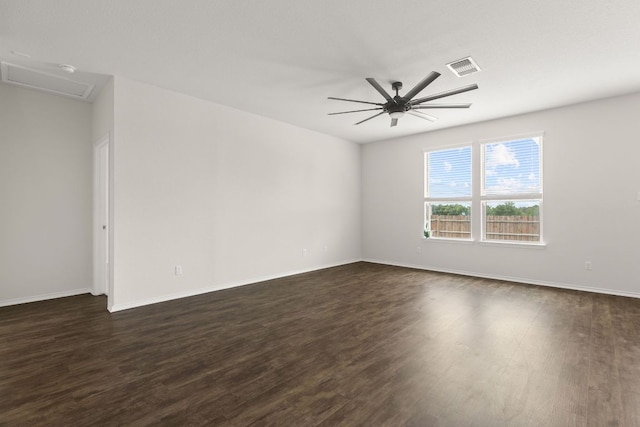 709 Hummingbird Ln, Leander, TX 78641 - empty room with dark wood finished floors, attic access, a ceiling fan, and baseboards