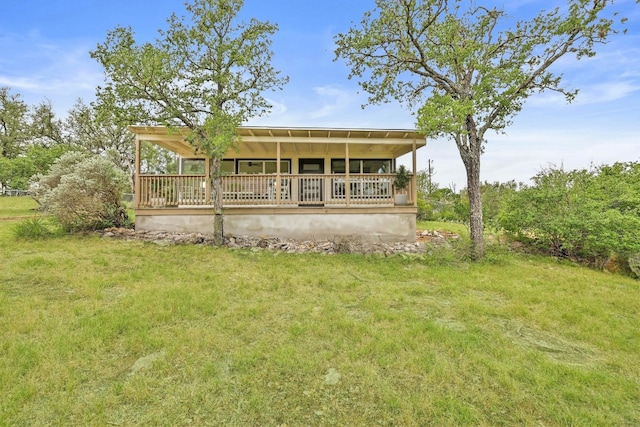 409 Lake View Dr, Spicewood, TX 78669 - rear view of house featuring a yard