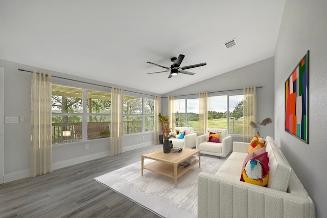 409 Lake View Dr, Spicewood, TX 78669 - living room featuring vaulted ceiling, a ceiling fan, wood finished floors, and baseboards