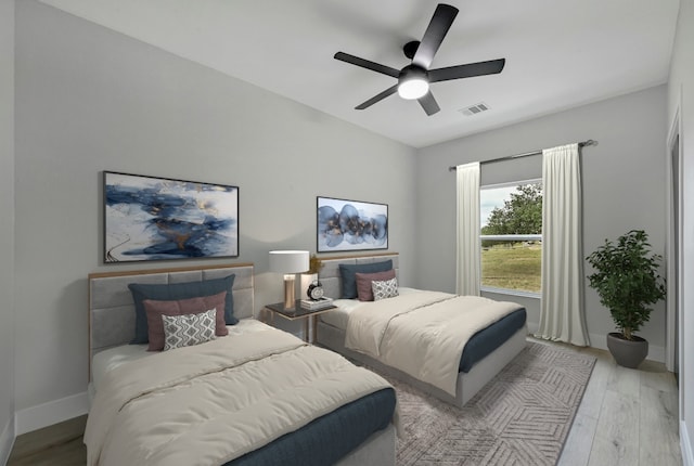 409 Lake View Dr, Spicewood, TX 78669 - bedroom featuring wood finished floors, baseboards, and a ceiling fan