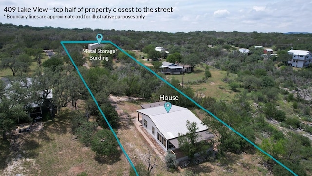 409 Lake View Dr, Spicewood, TX 78669 - aerial view of property and surrounding area featuring property boundaries highlighted and a forest