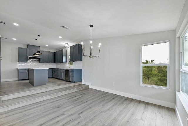 409 Lake View Dr, Spicewood, TX 78669 - kitchen with appliances with stainless steel finishes, baseboards, a sink, light countertops, and recessed lighting