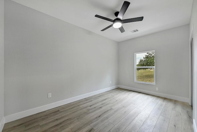 409 Lake View Dr, Spicewood, TX 78669 - empty room with wood finished floors, baseboards, and a ceiling fan