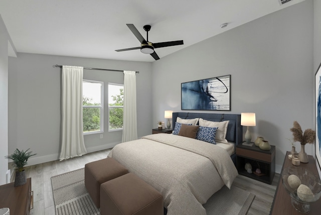 409 Lake View Dr, Spicewood, TX 78669 - bedroom featuring wood finished floors, baseboards, and a ceiling fan