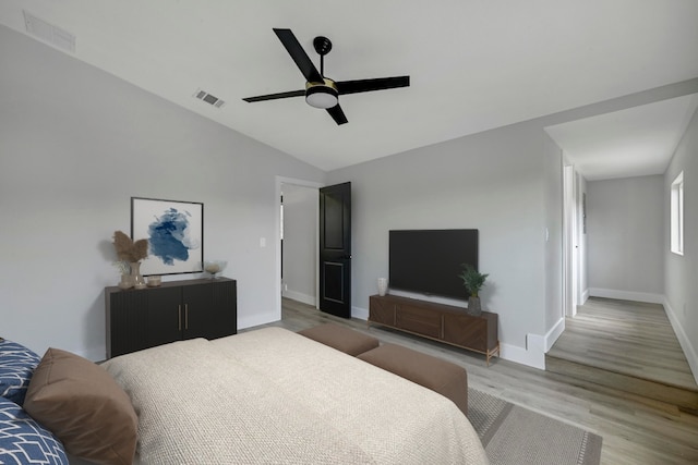 409 Lake View Dr, Spicewood, TX 78669 - bedroom featuring light wood-style floors, lofted ceiling, baseboards, and ceiling fan