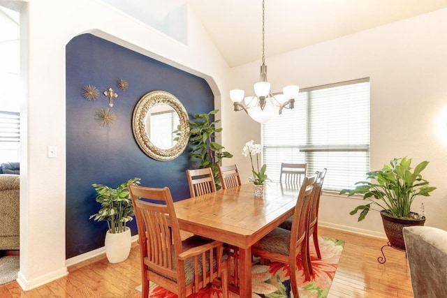 252 Hutton, Kyle, TX 78640 - dining area featuring light wood-style floors, a chandelier, lofted ceiling, and baseboards