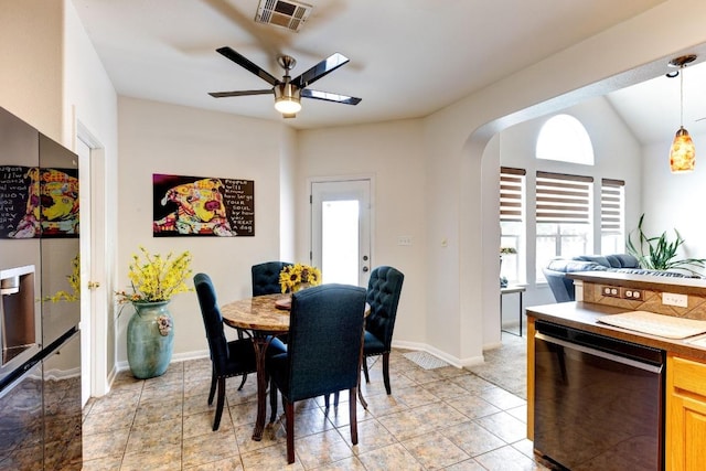 252 Hutton, Kyle, TX 78640 - dining space featuring ceiling fan, arched walkways, vaulted ceiling, and baseboards