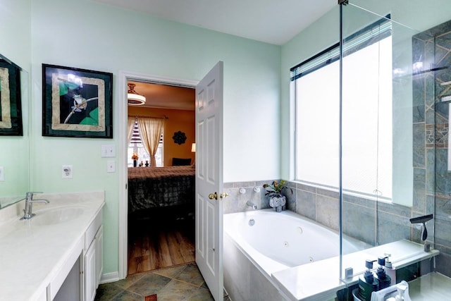 252 Hutton, Kyle, TX 78640 - ensuite bathroom with a whirlpool tub and vanity