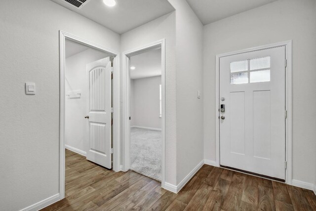 210 Briggs Ln, San Marcos, TX 78666 - entrance foyer with wood finished floors and baseboards