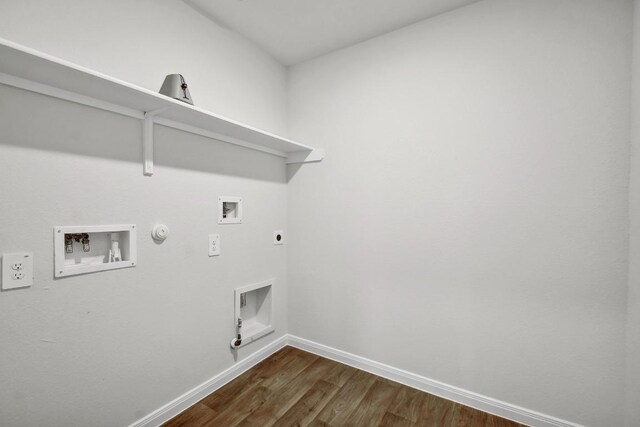 210 Briggs Ln, San Marcos, TX 78666 - laundry area with gas dryer hookup, washer hookup, baseboards, dark wood-style floors, and electric dryer hookup