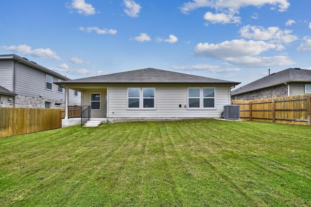 210 Briggs Ln, San Marcos, TX 78666 - back of house featuring cooling unit and roof with shingles