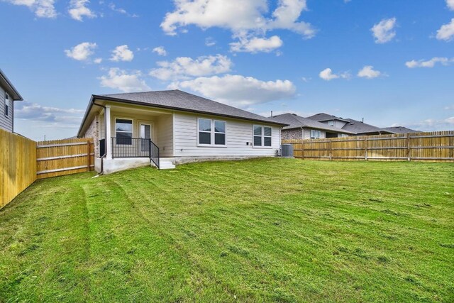 210 Briggs Ln, San Marcos, TX 78666 - rear view of house featuring cooling unit