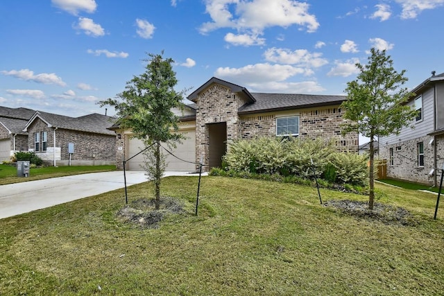 210 Briggs Ln, San Marcos, TX 78666 - view of front of property featuring driveway, a front yard, brick siding, and a garage