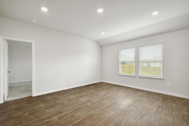 210 Briggs Ln, San Marcos, TX 78666 - spare room with dark wood-style flooring, baseboards, lofted ceiling, recessed lighting, and a smoke detector